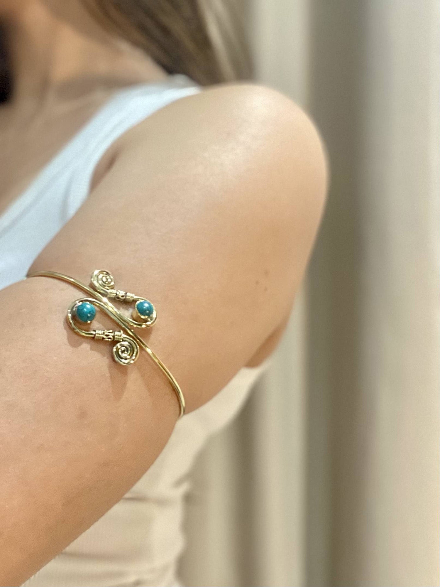 Gold armcuff with turquoise stone